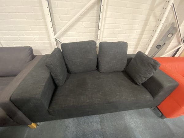 Dark grey sofa with pillows