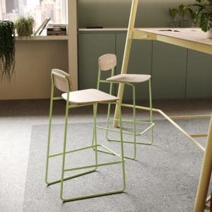 Two Faye high chairs near desk