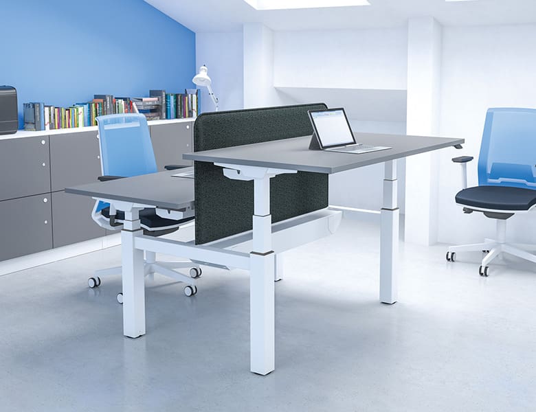 Contemporary office space with adjustable desks and blue chairs