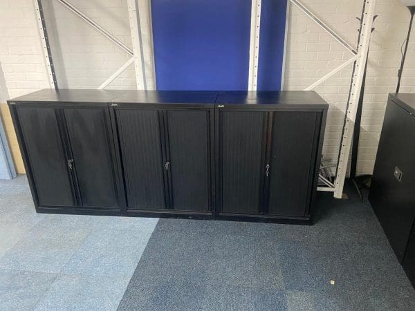 Three black cupboards