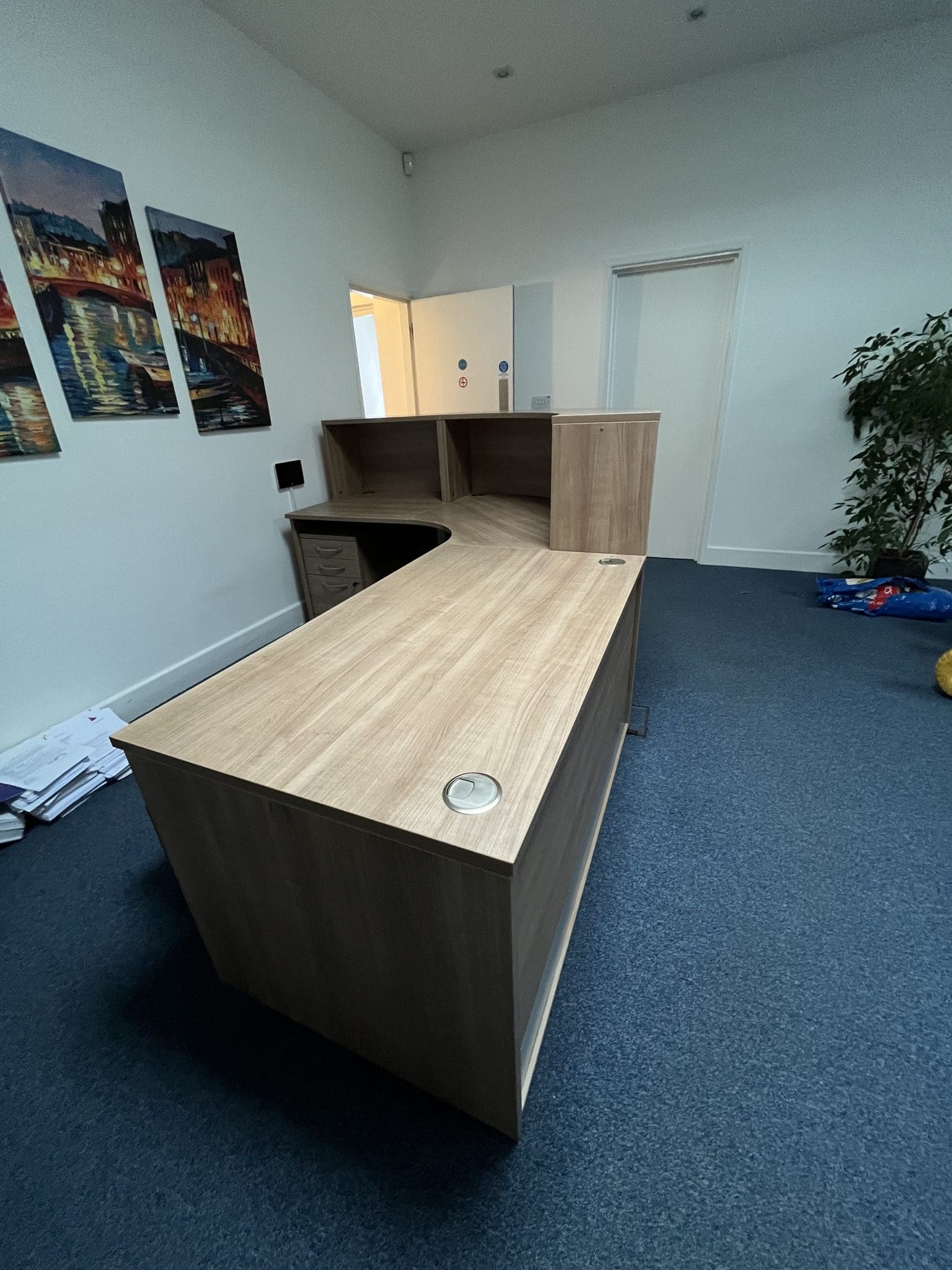 Wooden rounded corner reception desk side view