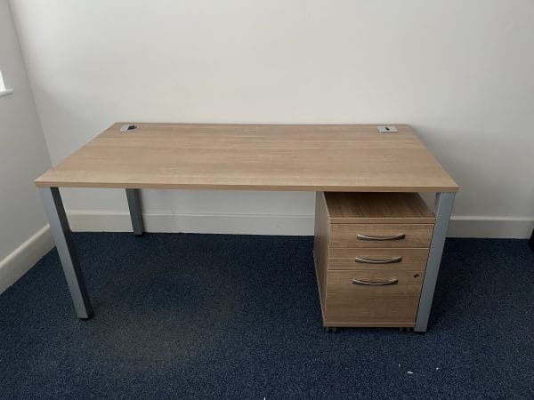 Wooden desk with metal legs, and a wooden cabinet underneath the desk