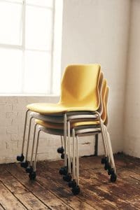 Stacked chairs near window
